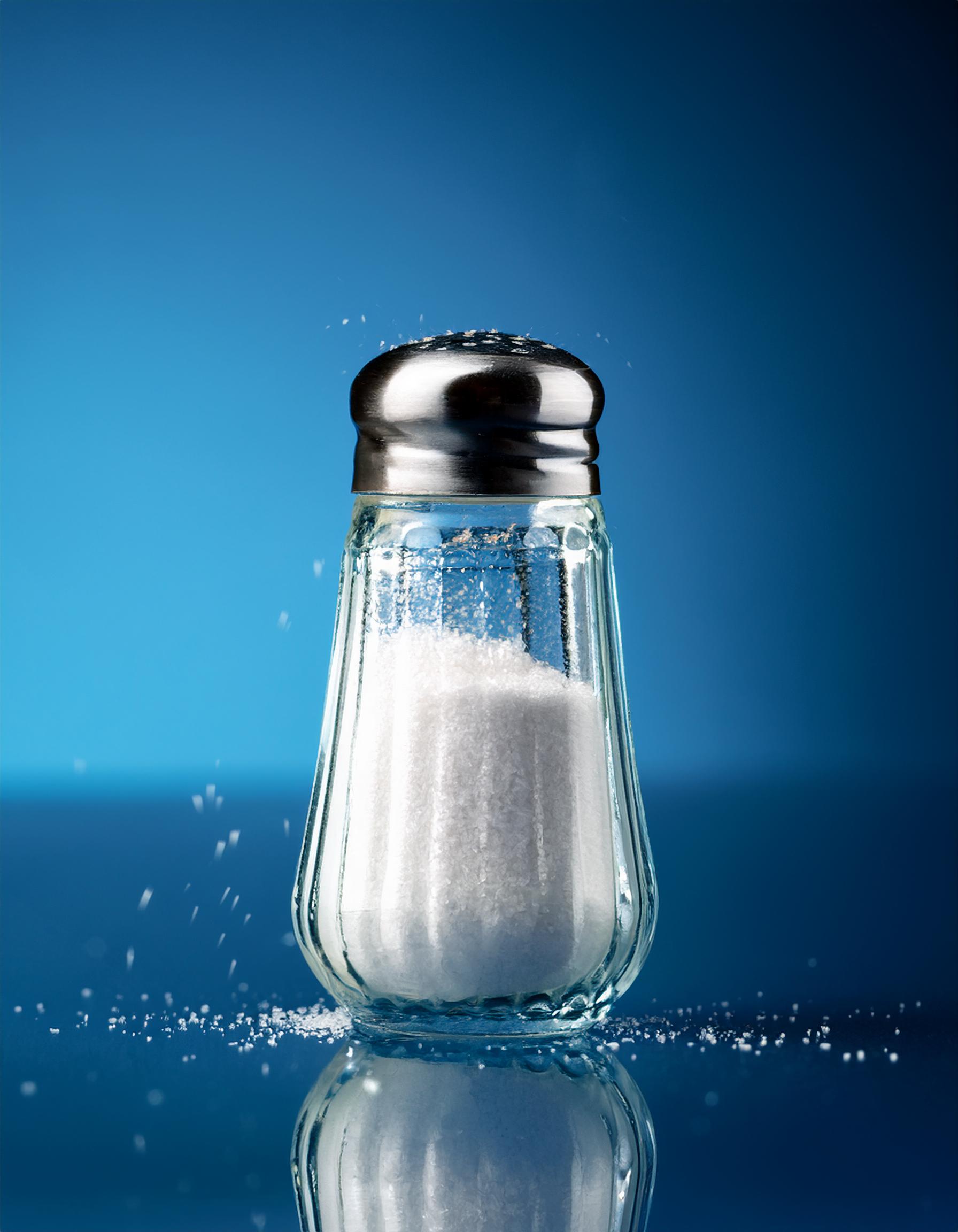 Firefly salt shaker, on a blue glass table 60256